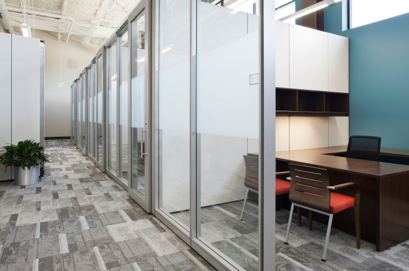 Haworth Enclose moveable wall offices with glass fronts and laminate side panels