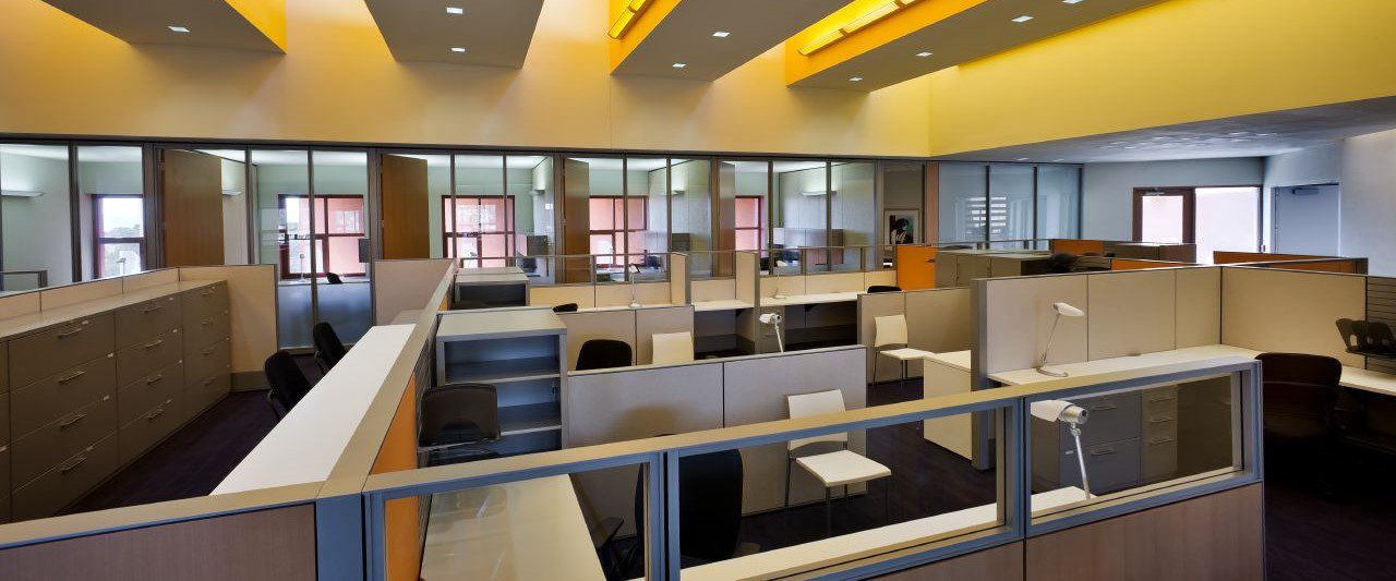 Haworth systems furniture workstations installed in a yellow office