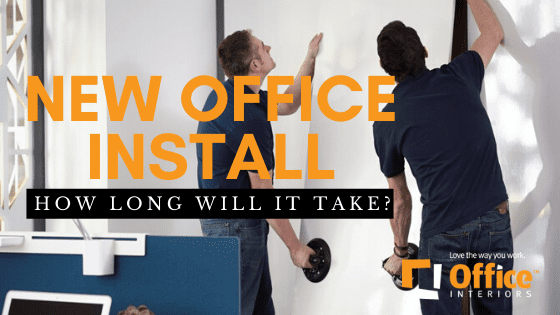 Two men installing office furniture or moveable walls
