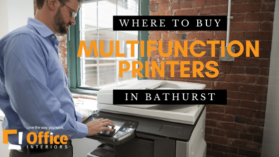 A business man with glasses using the Multi-function printer